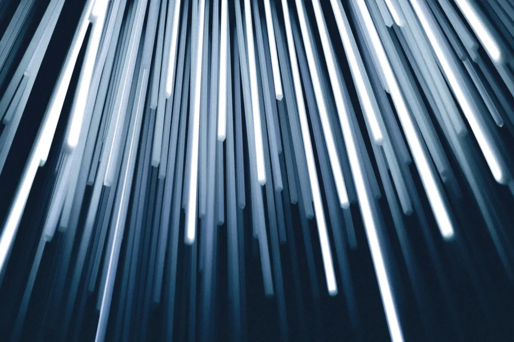 Close-up of light travelling through fibre optic strands