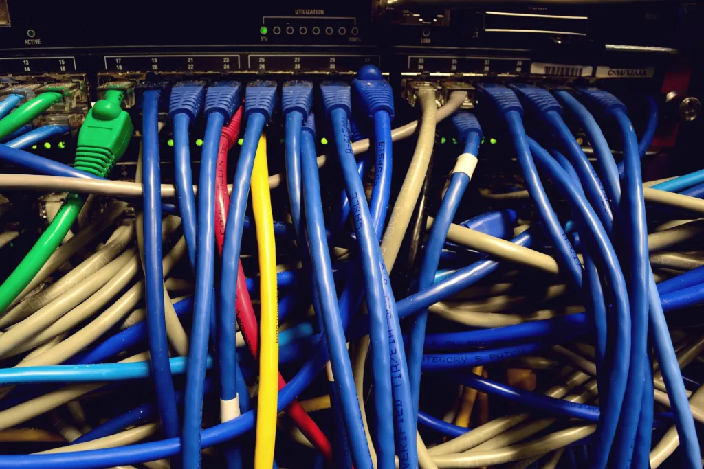 Network switch with many blue patch cables